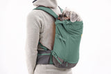Person carrying a dog in the Ruffwear Hitch Hiker Dog Backpack Carrier for comfortable adventures.